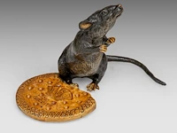 A cold-painted vienna bronze mouse with biscuit by franz xavier bergmann (1861-1936) 12 x 16 x 10 cm. (4.71 x 6.29 x 3.94 in.)