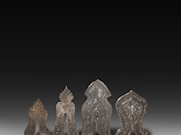 A collection of four engraved silver judaica circumcision shields, 19thc, h 8,5 cm (tallest) - total weight: 150 g