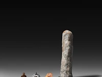 A collection of four roman bronze fascinum phallic amulets, h 4,5 cm (tallest)