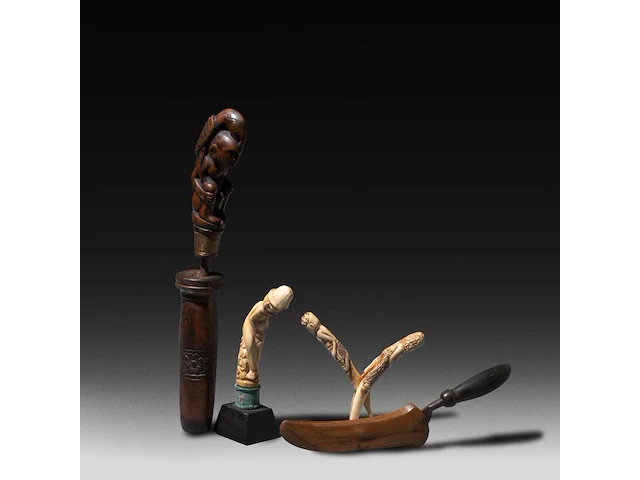 A collection of indonesian tribal circumcision items and phallic handles of a kris, sasak people, lombok, h 28 cm (tallest) - afbeelding 1 van  8