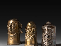 A collection of two brass and one silver ekamukha lingam covers with shiva's head, india 13 cm. (5.12 in.)
