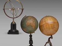 A copernican armillary sphere and two matching vintage globes the sphere: 60 cm. (23.62 in.), tallest globe: 55 cm. (21.64 in.)