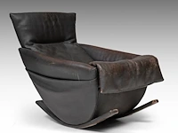 A dark leather rocking chair by de sede, 1970s 87 x 72 x 100 cm. (34 1/4 x 28.35 x 39.36 in.)