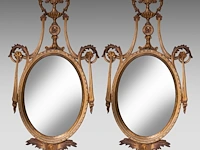 A decorative pair of neoclassical wall mirrors 125 x 64 cm. (49.21 x 25.19 in.)