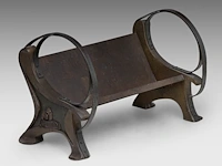 A fine art nouveau patinated bronze wine bottle holder, shaped as a garden bench 23.5 x 36 cm. (9 1/4 x 14.16 in.)