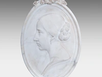 A fine basso-relievo carved carrara marble oval plaque with the profile portrait of a lady, ca. 1900 52 x 35 cm. (20.46 x 13.77 in.)