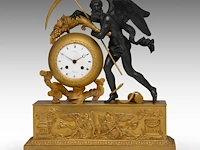 A fine empire gilt and patinated bronze mantle clock with chronos on top, by jean-joseph hanset, ca. 1815 41 x 36 cm. (16.14 x 14.16 in.)