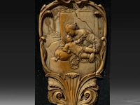 A fine ivory renaissance style plaque depicting the madonna and child in a cartouche, 16th/17thc, h 13,5 cm - w 8 cm (+)
