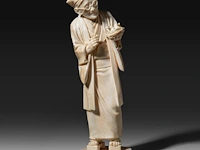 A fine japanese ivory okimono of a man with glasses examining a nest of birds in his hand, signed, tokyo school, meiji period (1868-1912), h 20,5 cm (+)