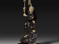 A fine japanese wood and walrus ivory okimono of a hunter fighting a tiger, signed, meiji period (1868-1912), h 31 cm (*)