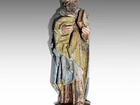 A fine polychrome oak sculpture of a saint, early 16thc, flemish 72 cm. (28.35 in.)