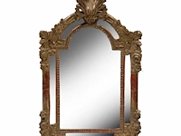 A fine régence giltwood wall mirror, decorated with carved flowers, mid 18thc 72 x 45 cm. (28.35 x 17.71 in.)