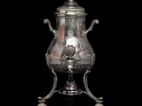 A french silver water kettle on turned wooden feet, french hallmark (1838-1961), 925/000, makers' mark risler & carré, paris, h 35 cm, 1395 g, the burner is added and marked christofle