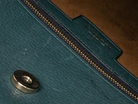 A green delvaux 'verdict' handbag in ostrich leather 37.5 cm. (14.75 in.) - afbeelding 10 van  10