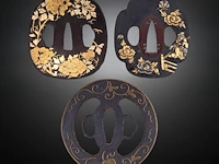 A group of three japanese tsuba sword guards, iron and gilt bronze, late edo/meiji, 7,9 x 8 cm / 6,1 x 6,8 cm / 6,5 x 7,3 cm