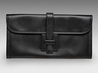 A hermès jige black box calf clutch 15 x 29 cm. (5.91 x 11.41 in.)