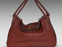 A hermès lindy 34 rouge hermès veau swift leather handbag with cc hardware 22 x 34 x 16 cm. (8.66 x 13.39 x 6.29 in.)