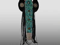 A himalayan ladakhi perak headpiece with metalwork, coral beads, turquoise and agate cabochons, shells, and braids, 20thc, l 77,5 cm