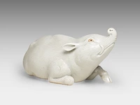 A japanese hirado white-glazed porcelain okimono of a boar, meiji period (1868-1912), l 24 cm