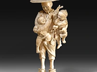 A japanese ivory okimono of a farmer with his two children, signed, meiji period (1868-1912), h 20 cm - 551g (+)