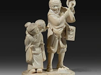 A japanese ivory okimono of a man with a basket and singing bowl, with a girl carrying a child to his side, signed, meiji period (1868-1912), h 18 cm - w 12 cm - d 10 cm (+)