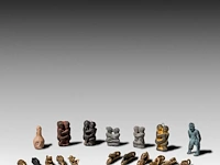 A large collection of small thai palad khik phallic amulets, h 6,5 cm (tallest)