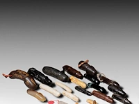 A large collection of thai palad khik phallic amulets, h 9,5 cm (tallest)