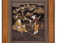 A large japanese black and gold lacquered panel with shibayama inlay of ivory and mother-of-pearl depicting a man resting under a tree being offered a fish by a passing salesman, meiji/taisho period (early 20thc), frame