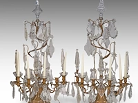A large pair of brass and crystal cut girandoles with a central spiral shape, 19thc 101 cm. (39.75 in.)