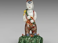 A ming-style polychrome glazed figure of he he er xian, 18thc, total h 25,5 cm