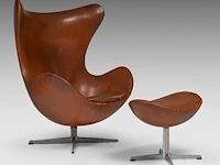 A nice vintage cognac leather egg chair with ottoman by arne jacobsen for fritz hansen