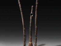 A pair of african tribal phallic scepters and a matching flute, h 57,5 cm (tallest)