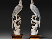 A pair of chinese ivory sculptures of birds perched on branches, late qing dynasty, total h 21 cm - ivory h 18 cm - weight each ca. 180g (+)