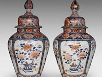 A pair of japanese imari 'flower baskets' lidded vases, edo period, total h 50 cm