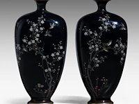 A pair of japanese midnight blue cloisonné enameled vases with a decor of birds among cherry blossoms and bamboo stalks, meiji period (1868-1912), h 15 cm