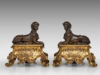 A pair of louis xiv style gilt and patinated bronze sphinx andirons 26.5 x 26.5 cm. (10.42 x 10.42 in.)