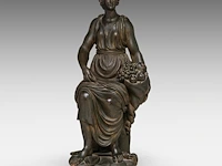 A patinated terracotta sculpture of an allegory of victory 68 cm. (26.76 in.)