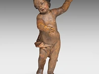 A polychrome limewood sculpture of a putto, 18thc 68 cm. (26.76 in.)