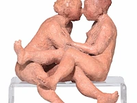 A polychrome painted terracotta sculpture of two lovers, h 24,5 cm