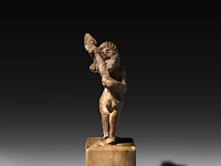 A rare etruscan priapus holding a phallus 5 cm. (1.97 in.)