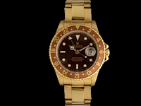 A rolex gmt-master, ref. 16758, 18ct yellow gold with brown dial and bezel