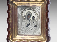 A russian orthodox travel icon of our lady of iveron, with a silver oklad, ca. 1900 the icon: 22.5 x 18 cm. (8.85 x 7.08 in.), the case: 35 x 30.5 cm. (13.77 x 12.00 in.)