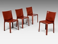 A set of 4 leather cab chairs by mario bellini for cassina 83 x 45 x 48 cm. (32.67 x 17.71 x 18.89 in.)