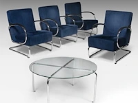 A set of four 407 armchairs and a matching circular coffee table, designed by willem hendrik gispen by dutch originals the chair: 83 x 59 x 82 cm. (32.67 x 23.23 x 32.28 in.), the table 47 x 90 cm. (18 1/2 x 35.42 in.)