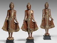 A set of three burmese lacquered wood standing figures of the buddha, late 19th century, total h 132 - 135 cm