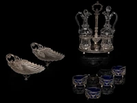 A silver oil and vinegar, two footed trays and a set of four salts and mustard, total weight: 1469 g