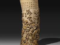 A very fine high relief carved chinese ivory bushpot with many types of birds among a rich variety of branches, leaves and flowers, signed, qing dynasty (probably 18thc), h 31,5 cm - ø 13 cm (+)