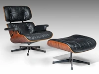 A vintage lounge chair with an ottoman by charles & ray eames for vitra, late '80s edition