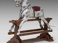 A vintage polychrome wooden carousel horse, h 115 - w 140 cm