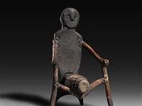 A wooden anthropomorphic chair with phallic-shaped drum, kalanguya (ifugao), philippines 103 x 62 cm. (40.54 x 24.41 in.)